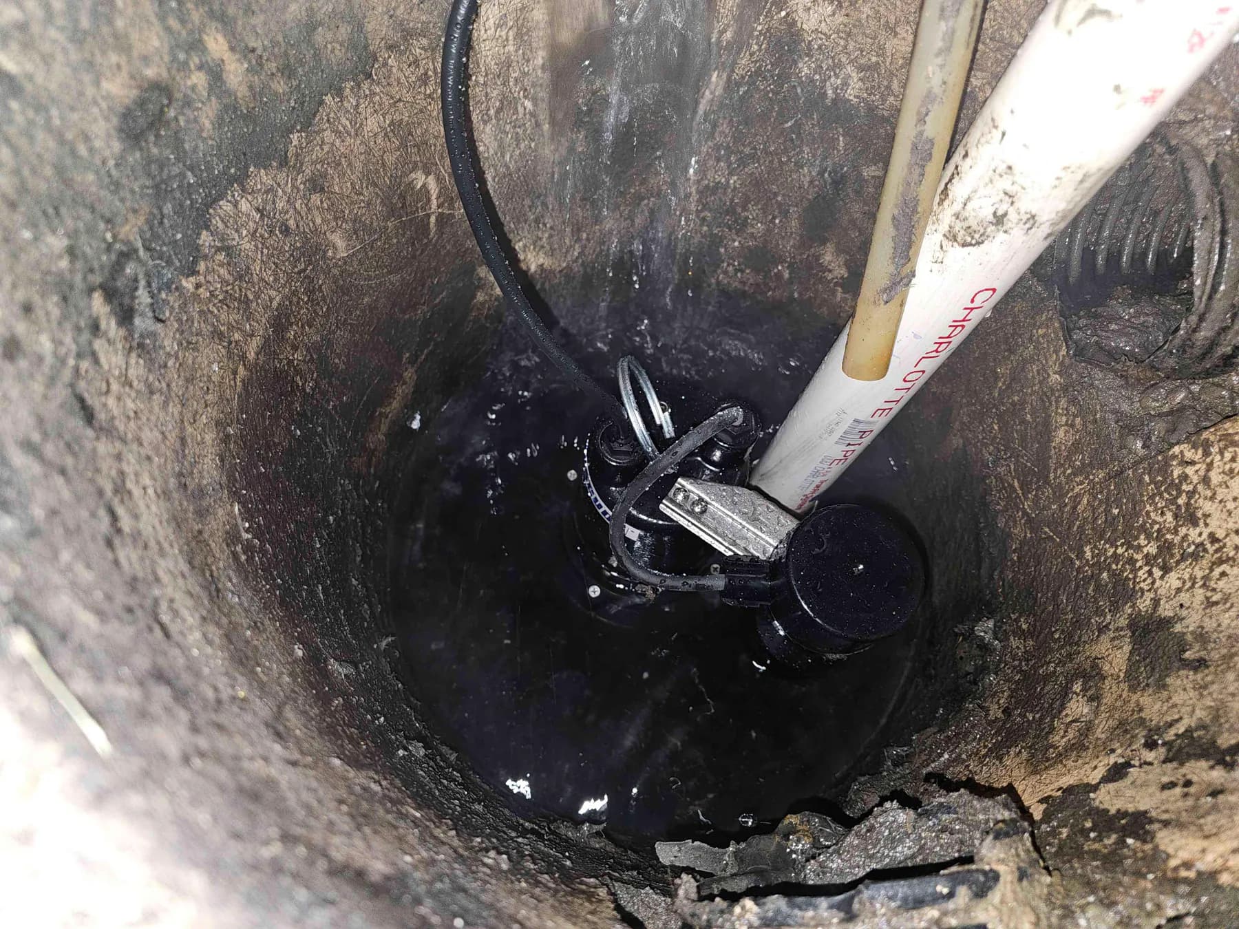 Sump pump operating inside the basin during testing