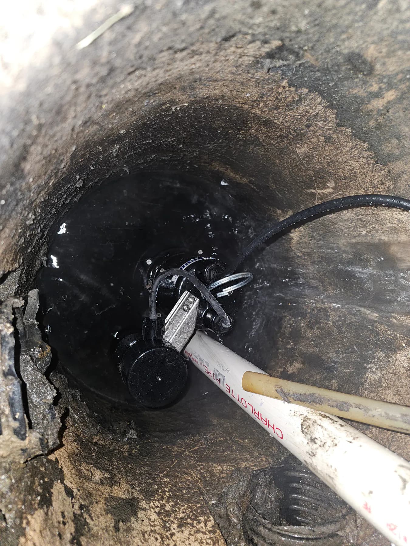 Finished sump pump, pipe, and float switch arrangement